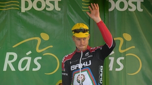 Connor McConvey, second overall on GC, salutes the crowd.