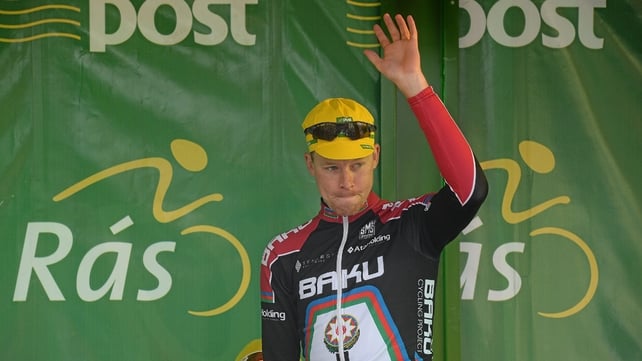 Connor McConvey, second overall on GC, salutes the crowd.
