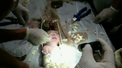 A tenant heard the baby's cries in the public restroom of a residential building
