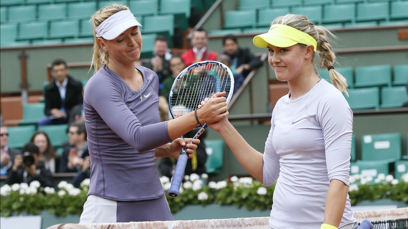 Maria Sharapova (L) shakes hands with Canada's Eugenie Bouchard afterwards