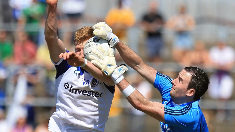 Antrim's Chris Kerr with Monaghan's Kieran Hughes