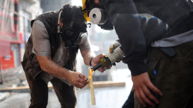 Protesters light petrol bombs as police try to clear Taksim square