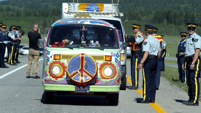 Canadian police allow a protester's van through a checkpoint near Toronto in 2002