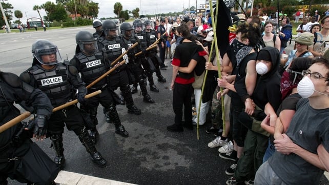 Police in riot gear keep protesters at bay in Brunswick, Georgia during the G8 summit at nearby Sea Island in 2004