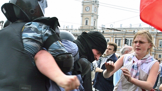 A protester is arrested by riot police ahead of the 2006 G8 summit in St Petersburg, Russia