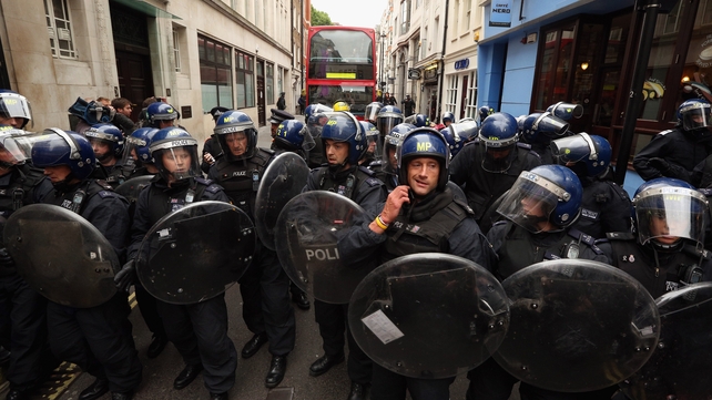 Riot police hold off protesters in London during a demonstration ahead of the G8 summit in Northern Ireland