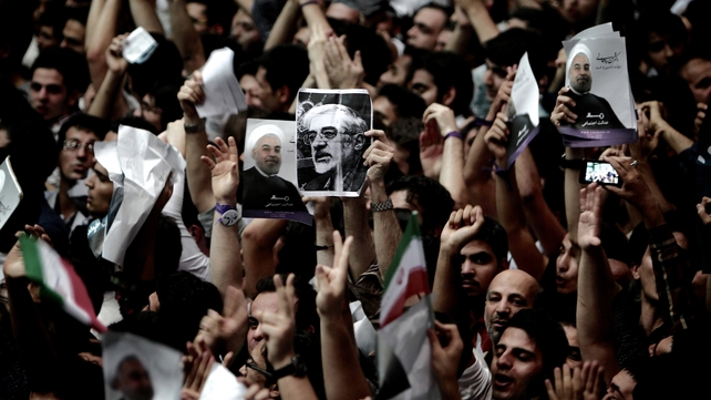 Iranian presidential candidates campaign for elections, as opposition leader Mir Hossein Mousavi remains under house arrest