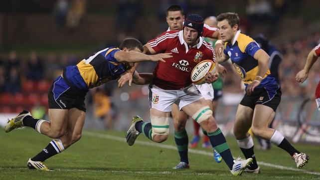 Sean O'Brien is tackled during the match between Combined Country and the British & Irish Lions in Newcastle, Australia