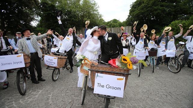 Bride and Groom Alfreda O'Brien and Ciaran Kavanagh taking part in the 20th Annual Bloomsday Messenger Bike Rally in Dublin ahead of their wedding