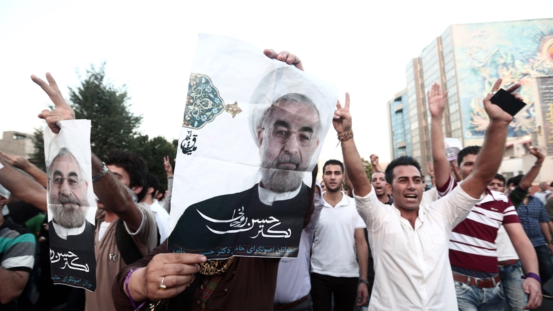 Hassan Rouhani's supporters have celebrated his victory on the streets of Tehran