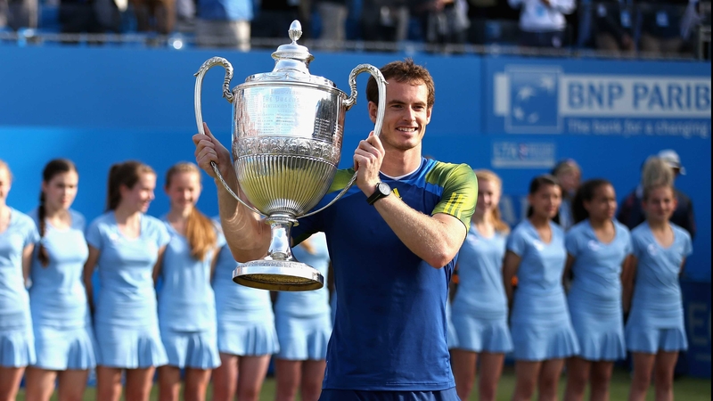 Andy Murray lifting the trophy he also won in 2009 and 2011