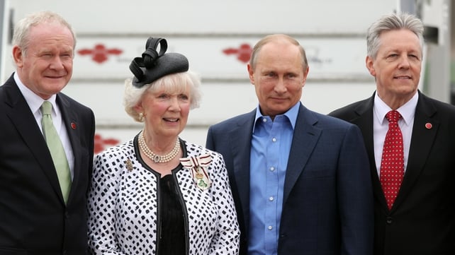 Russian President Vladimir Putin poses for a picture with Peter Robinson, Martin McGuinness (L) and Joan Christie, Queen Elizabeth's official representative in Co Antrim