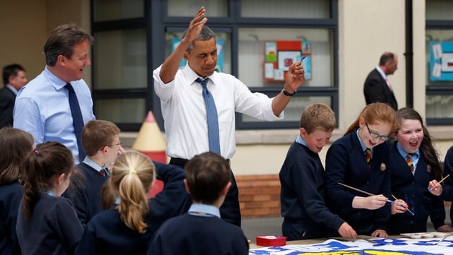 David Cameron and Barack Obama help students from Enniskillen Integrated Primary School work on a G8 project