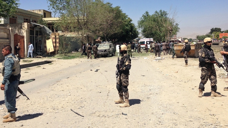 Afghanistan security forces stand guard near the site of an explosion in Kabul that left three people dead