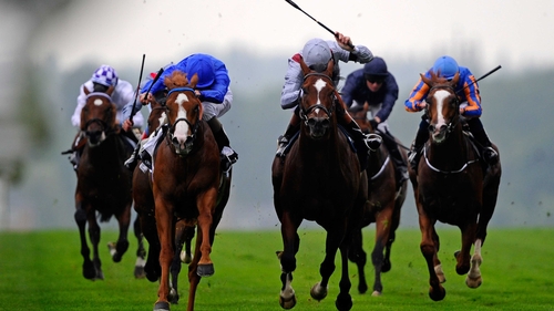 Dawn Approach (l) ridden by Kevin Manning claimed the day's top prize at Royal Ascot