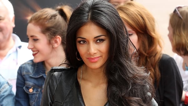 Scherzinger vamped it up in a black leather dress