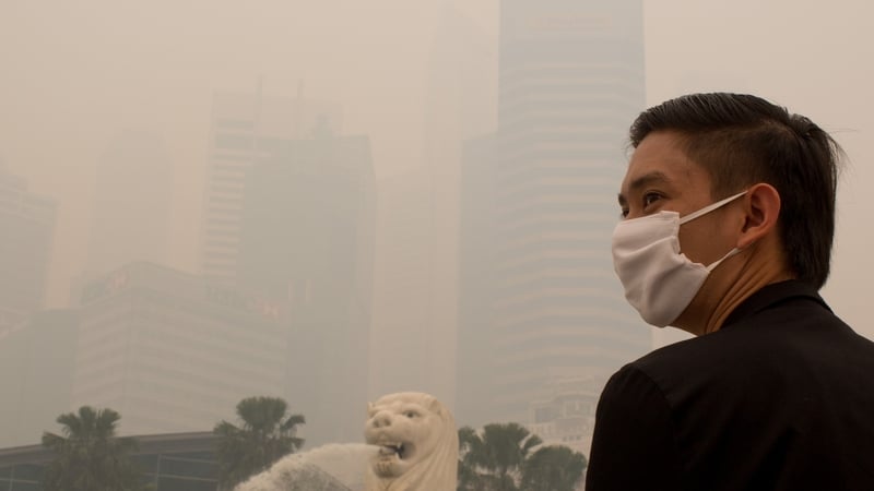 Free face masks were being distributed and people were advised to stay indoors in Singapore