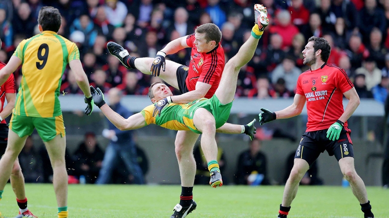 Donegal's Ryan Bradley and Calum King of Down contest possession