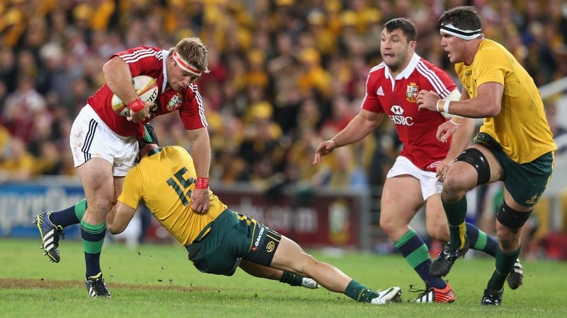 Tom Youngs is tackled by Berrick Barnes during the first Test in Brisbane