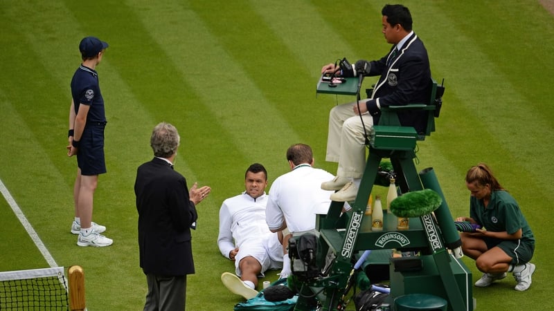 Jo-Wilfried Tsonga receives medical attention courtside