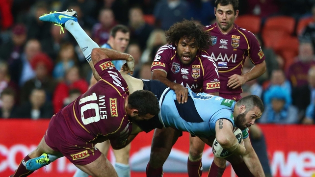 Aaron Woods is tackled during game two of the ARL State of Origin series between the Queensland Maroons and the New South Wales Blues
