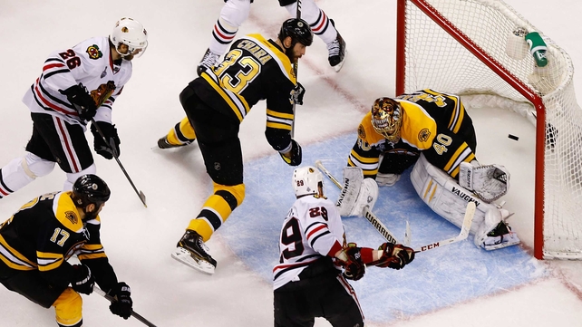 Bryan Bickell of the Chicago Blackhawks scores a goal against Boston Bruins during Game Six of the Stanley Cup Final