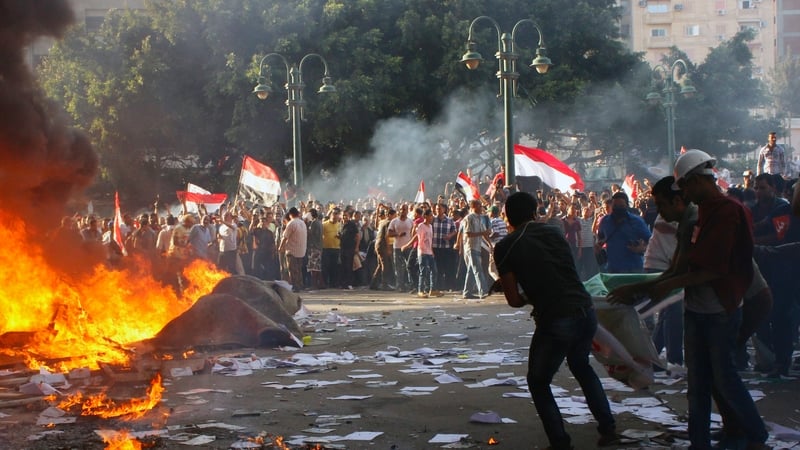Opponents of Mohammed Mursi burn the content of a Freedom and Justice Party office in the coastal city of Alexandria