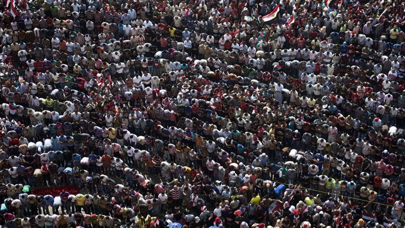 Opponents of Mohammed Mursi pray during a protest in Cairo's Tahrir Square