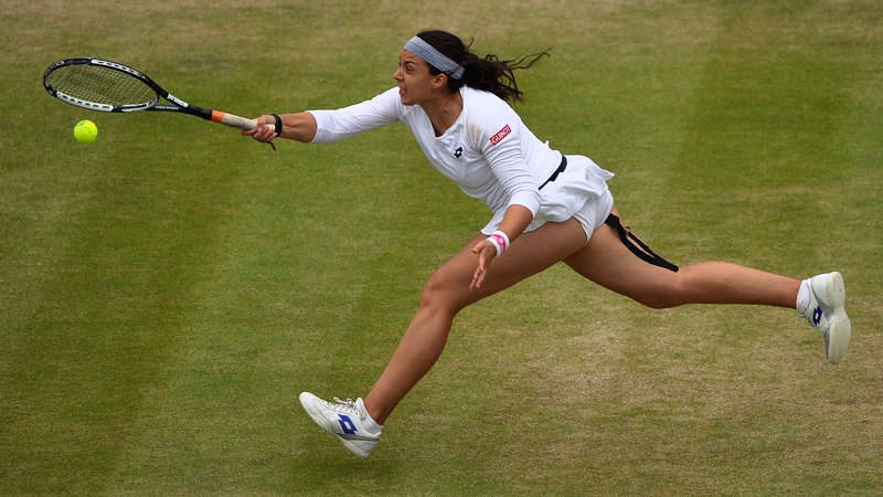 Marion Bartoli returns against US player Sloane Stephens