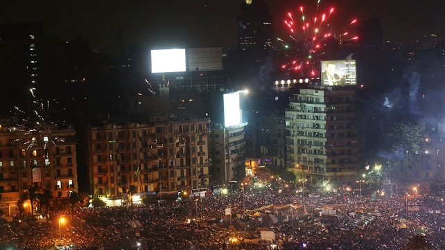Fireworks and cheering erupted in Cairo's Tahrir Square