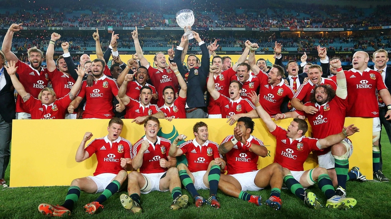 The Lions celebrate with the Tom Richards Trophy after the match