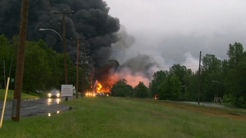 At least one dead and unknown number missing after runaway oil train crashes into Canadian town