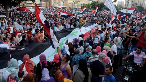 People protest in Alexandria, where 14 people died on Friday, clashes broke out again, but there were no immediate reports of casualties
