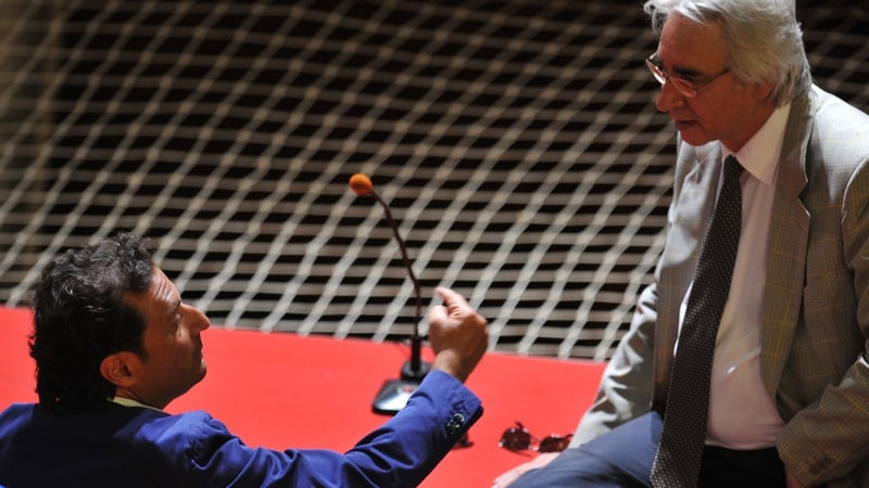 Francesco Schettino (R), speaks to one of his lawers, Domenico Pepe