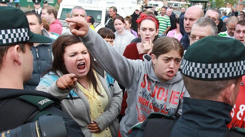 Nationalist protestors clash with police as Orangemen march past the Nationalist Ardoyne shops last year
