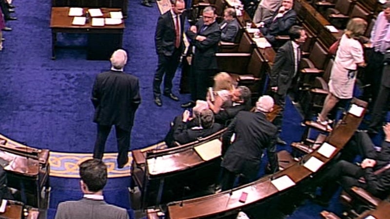 Tom Barry pulled colleague Áine Collins onto his lap