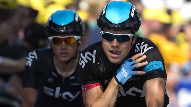 Edvald Boasson Hagen crosses the line holding his fractured shoulder