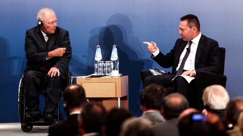Wolfgang Schaeuble (left) said Greece should not 'continue this discussion' on debt