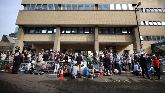 Reporters and photographers take position outside St Mary's Hospital