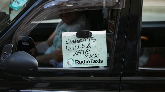 A London taxi driver offers his congratulations to the new parents