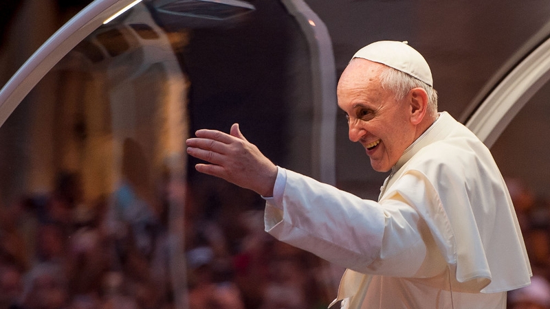 Pope Francis waves to the crowd after departing the Metropolitan Cathedral in Rio de Janeiro