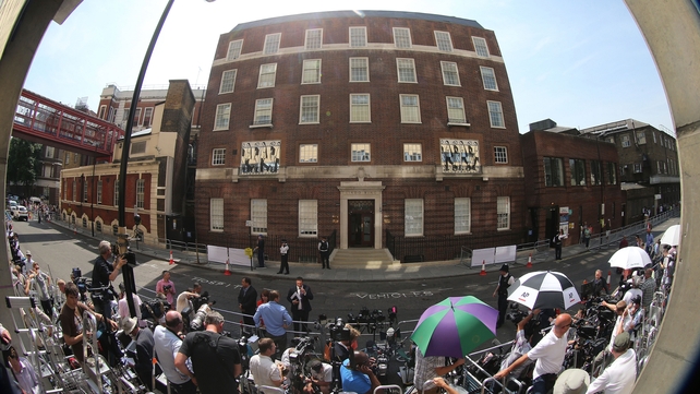 Royal watchers wait for the first glimpse of the new prince outside St Mary's Hospital