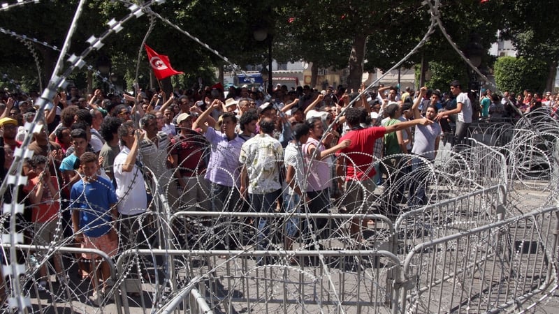 Protesters gathered outside the Interior Ministry after the assassination of Mohamed Brahmi on Thursday