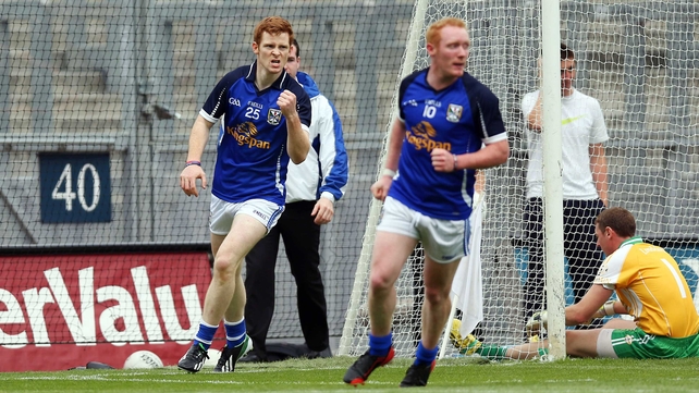 Niall McDermott (left) celebrates Cavan's goal as they secured victory over their English-based opposition