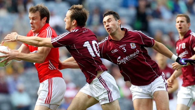 Cork's James Loughrey evades John O'Brien and Finian Hanley of Galway in their round four qualifier clash