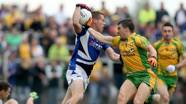 Laois' Darren Strong is marked by Paddy McGrath of Donegal