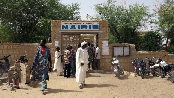 People arrive at Timbuktu's city hall, to check electoral lists, looking for the bureau in which they should vote