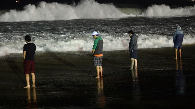 Pilgrims relieve themselves on the shore