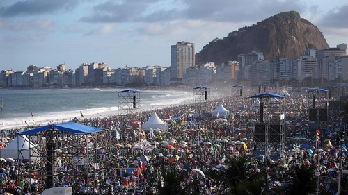 Pilgrims and others jam Copacabana beach ahead of the visit of Pope Francis