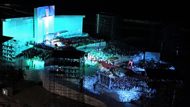 Huge crowds gathered at the beach for a night-time prayer vigil